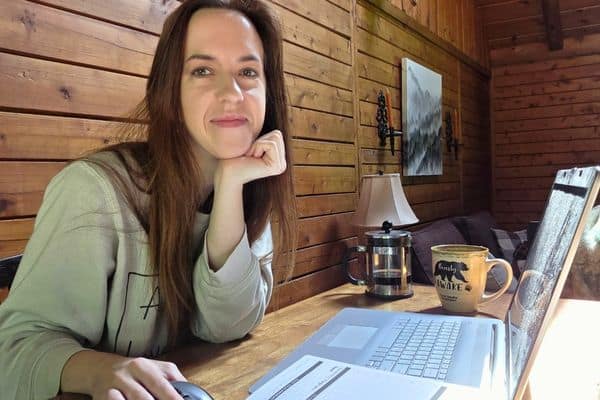 leah lynch sitting at a kitchen table working