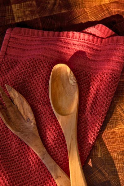 kitchen spoons on a red towl