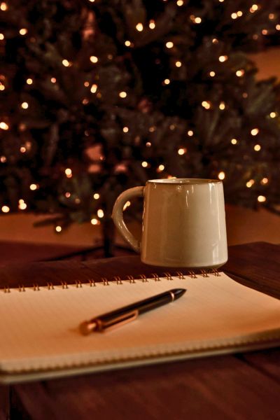 christmas planning header image with a christmas tree and note book