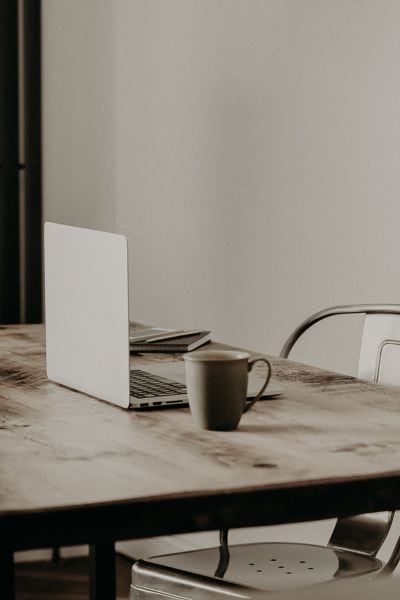 laptop on a desk of someone creating a waiting list for their farm business header image