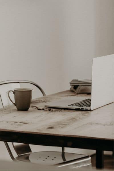 small office on a kitchen table, header image for how to promote your rabbitry on social media